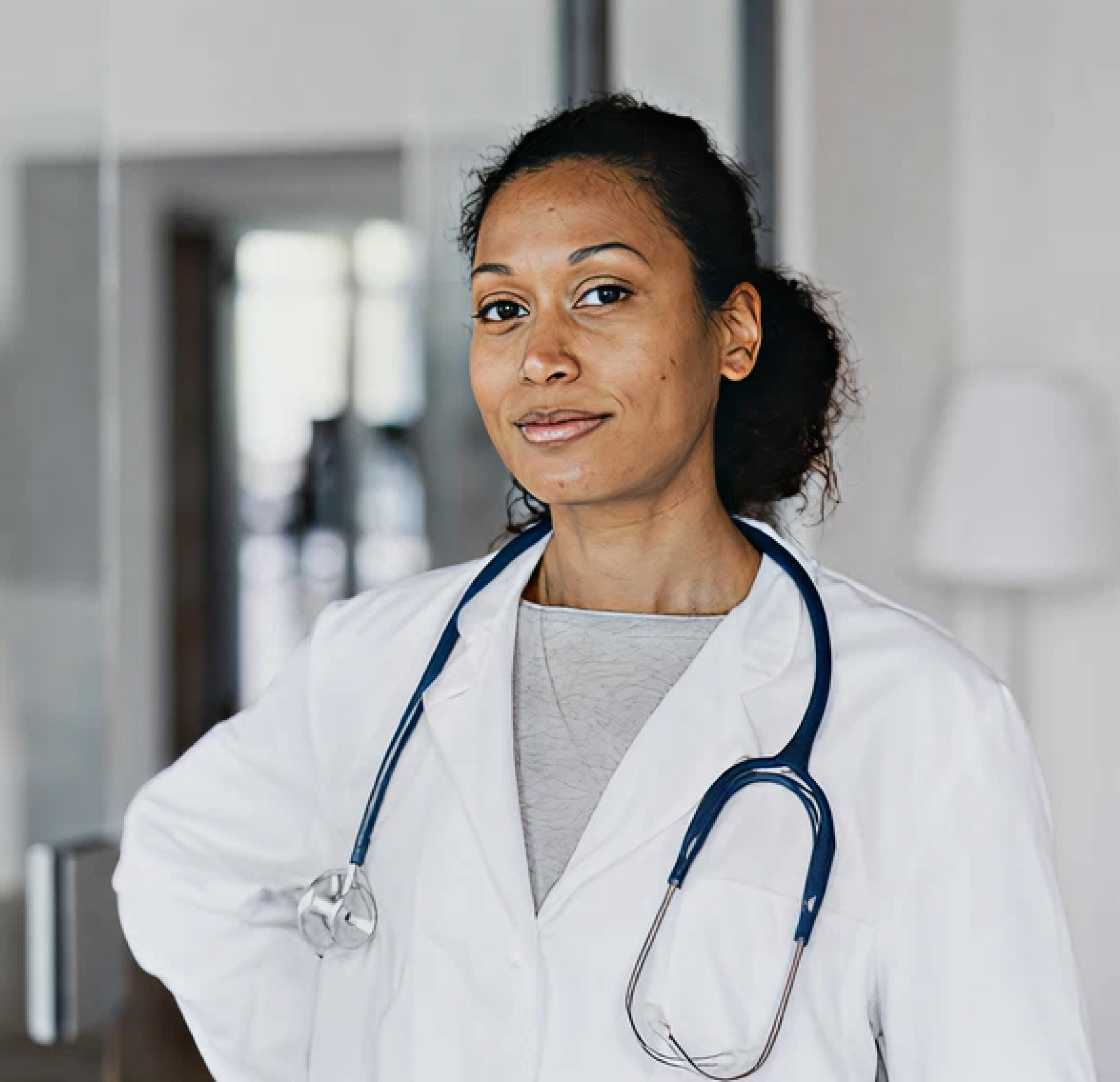 Smiling doctor wearing a stethoscope and glasses